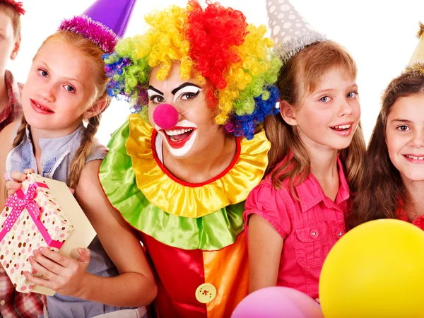 Birthday party group of teen with clown. Stock Picture