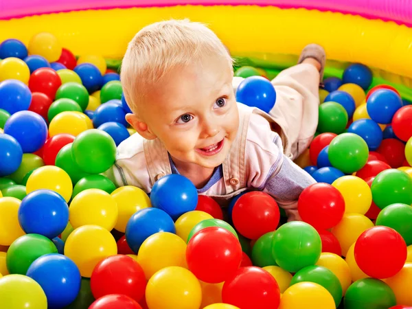 Child in colored ball. — Stock Photo, Image