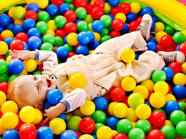 Child in colored ball. — Stock Photo, Image