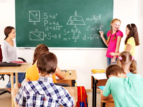 Niño de escuela con maestro . —  Fotos de Stock