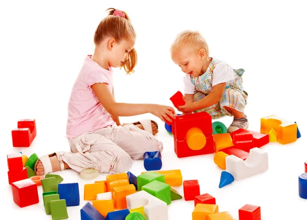 Children play building blocks. Royalty Free Stock Images
