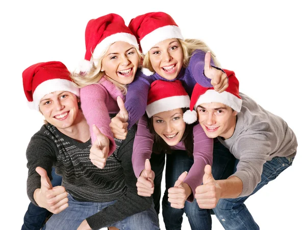 Noel Baba şapkası içinde genç grup . — Stok fotoğraf