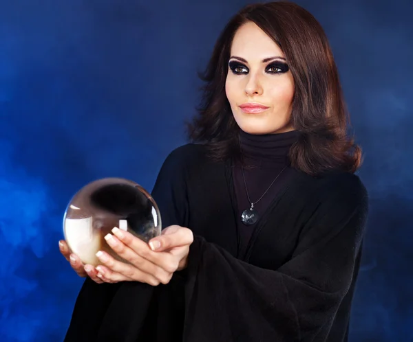 Young woman with crystal ball. — Stock Photo, Image