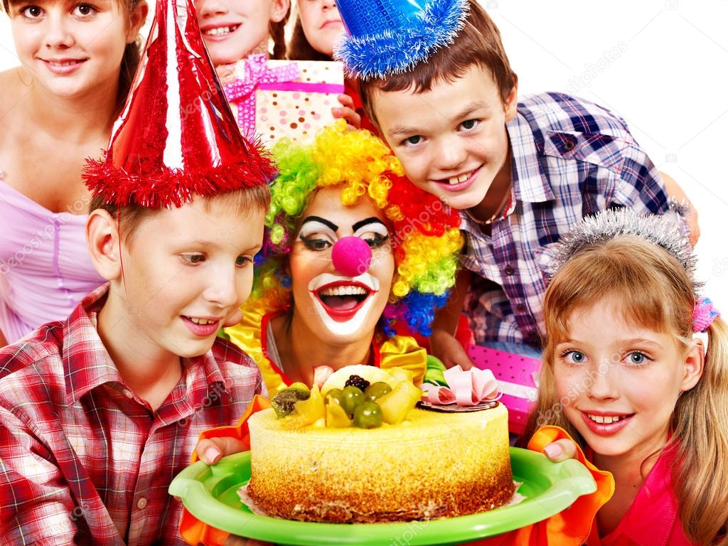 Birthday party group of child with cake.