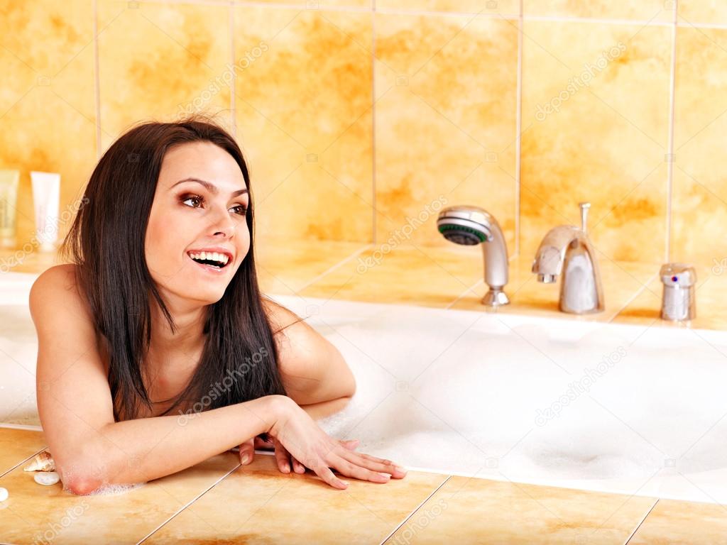 Young woman take bubble bath.
