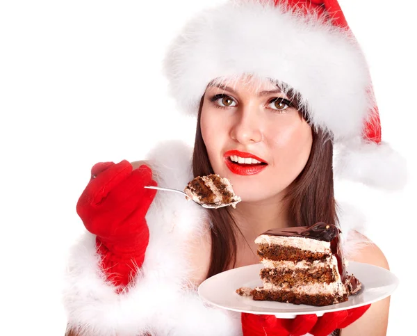 红色圣诞老人帽子和蛋糕的圣诞女孩. — 图库照片
