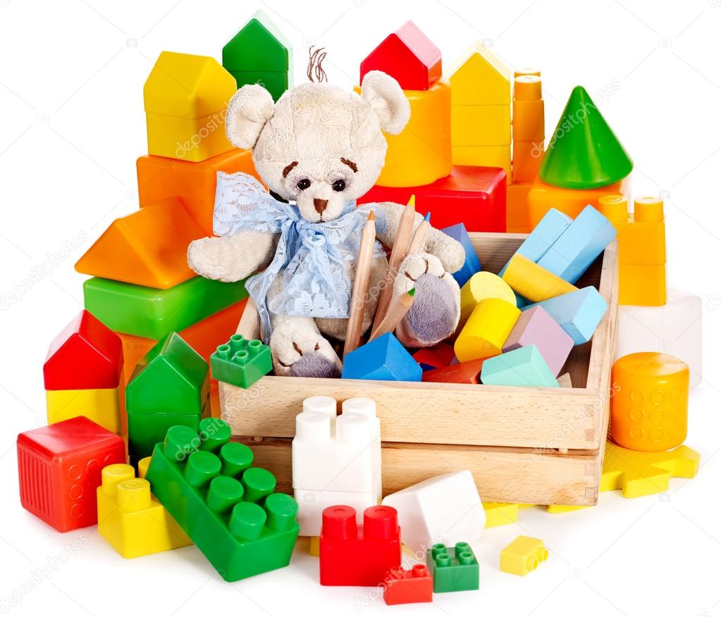 Teddy bear and cubes. Children toys.