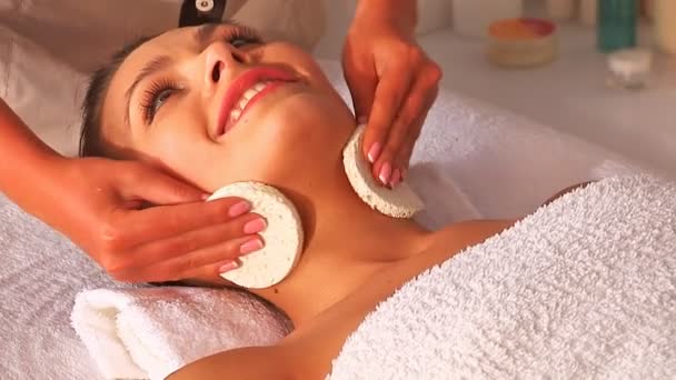 Beautiful woman in spa. Facial massage.