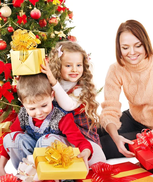 Children with gift box near Christmas tree. — Stock Photo, Image