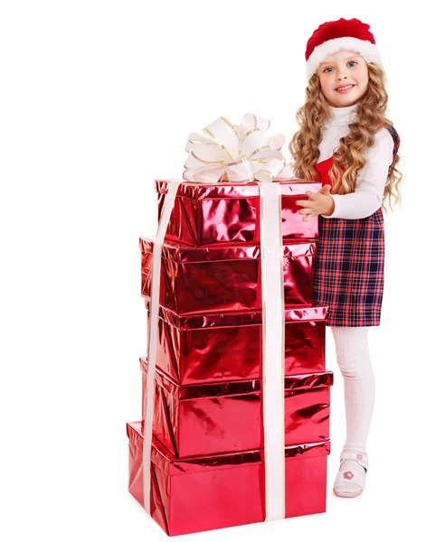 Дитина в капелюсі Санта зі стеком подарункової коробки . — стокове фото