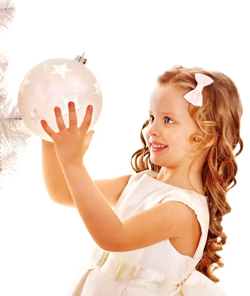 Child decorate white Christmas tree. Royalty Free Stock Images