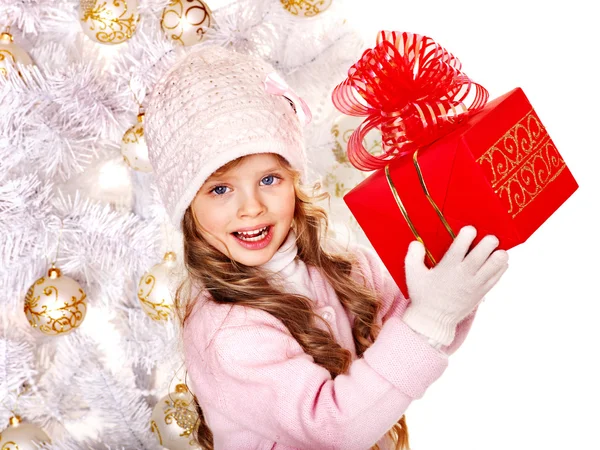 Child in hat and mittens holding red gift box . — Stock Photo, Image