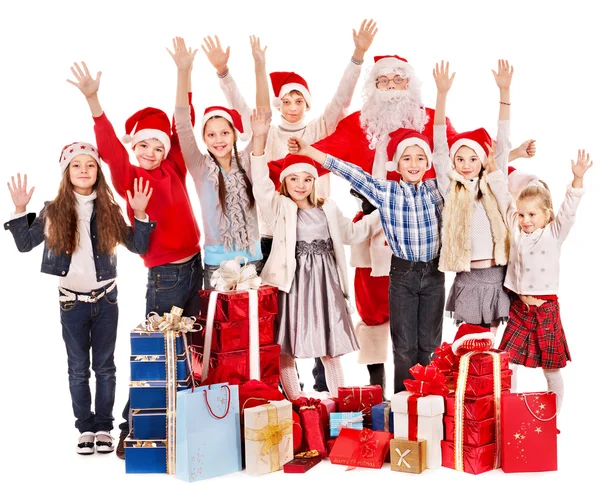 Grupp barn med jultomten. Stockbild