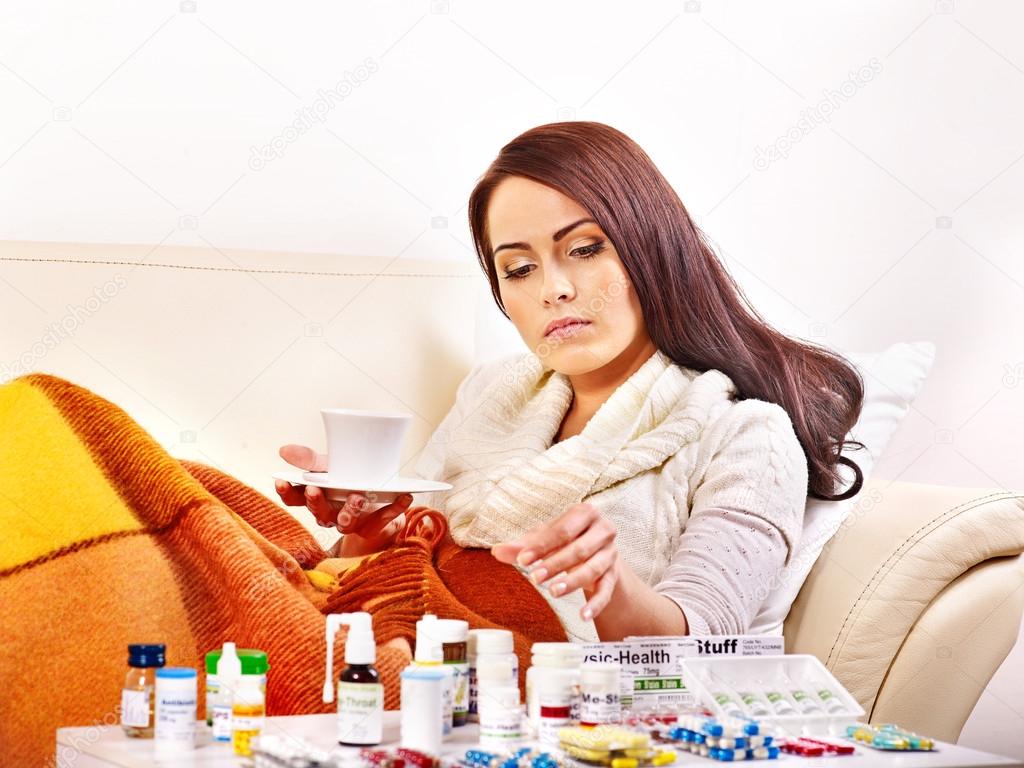Woman having pills and tablets.