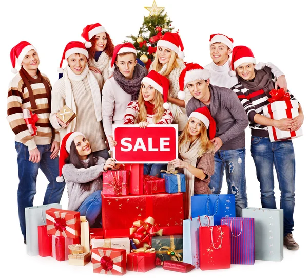 Girl in Santa hat holding Christmas gift box. — Stock Photo, Image