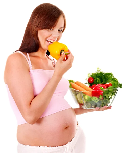 Mujer embarazada comiendo vegetales . — Foto de Stock