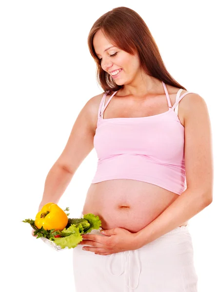 Mulher grávida comendo vegetais . — Fotografia de Stock
