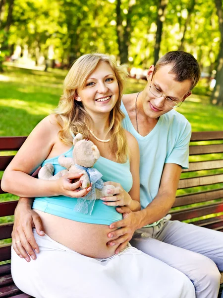 Pregnant woman with man outdoor. — Stock Photo, Image