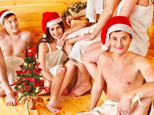 Group in Santa hat at sauna. — Stock Photo, Image