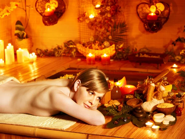 Woman getting massage in bamboo spa. — Stock Photo, Image