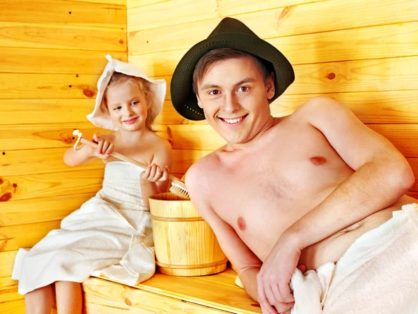 Family with child relaxing at sauna. — Stock Photo, Image