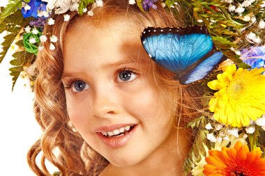 Child with butterfly and flower. clipart