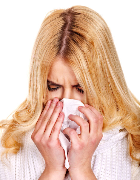 Young woman with handkerchief having cold.