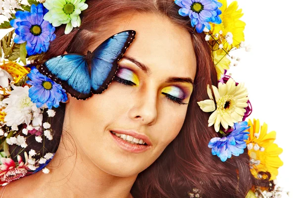 Woman with flower and butterfly. Stock Picture