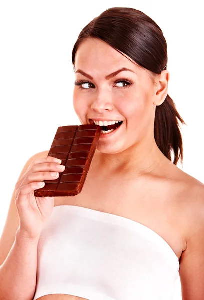 Beautiful girl bite chocolate bar. — Stock Photo, Image