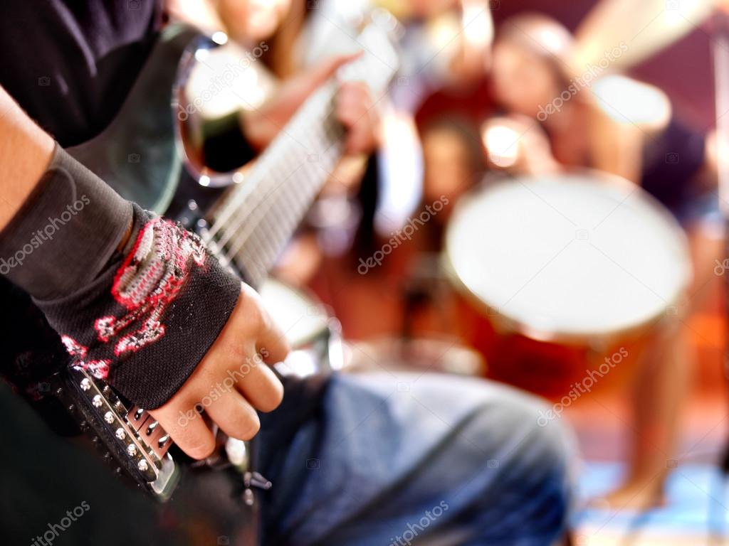 Band playing musical instrument.