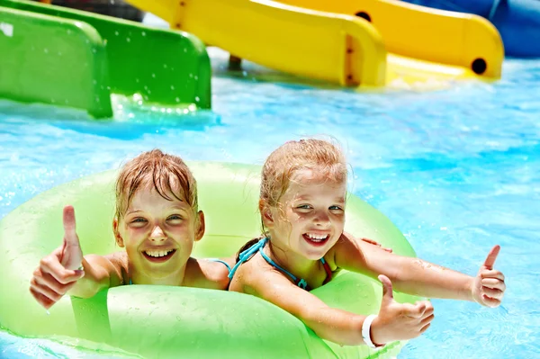 Children sitting on inflatable ring. — Stock Photo, Image