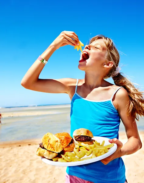 Child eating fast food. Stock Photo