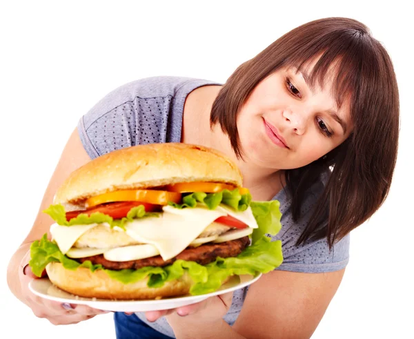 Žena jíst hamburger. — Stock fotografie