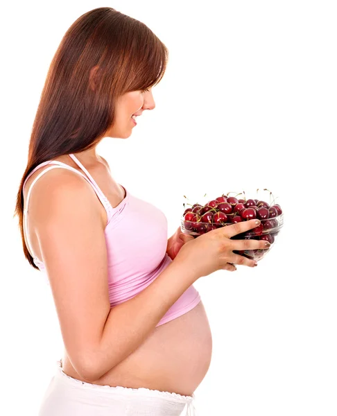 Gravid kvinna äta frukt. — Stockfoto