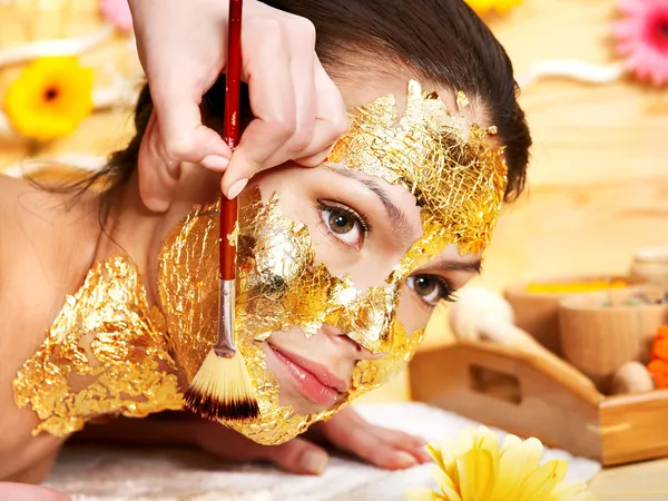 Woman getting facial mask . — Stock Image Woman getting facial mask . Royalty Free Stock Images