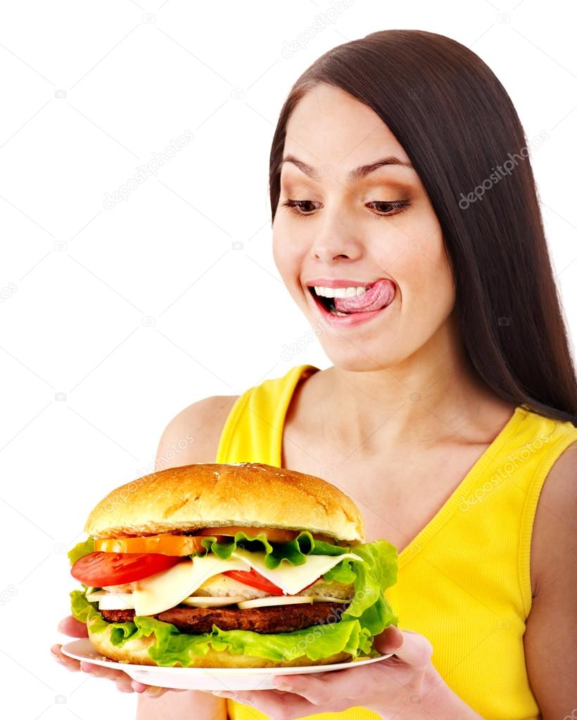 Woman holding hamburger.