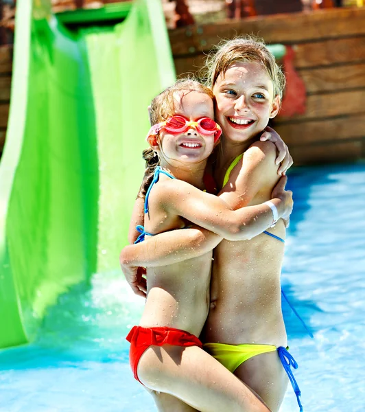 Children on water slide at aquapark. — Stock Photo, Image
