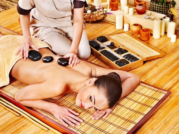 Woman getting stone therapy massage . — Stock Photo, Image