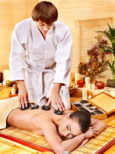 Woman getting stone therapy massage . — Stock Photo, Image