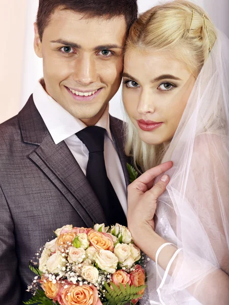 Wedding couple holding flower. — Stock Photo, Image