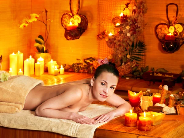 Woman getting massage in bamboo spa. — Stock Photo, Image