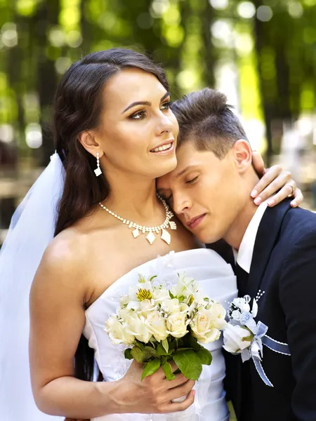 Groom embrace bride outdoor. — Stock Photo, Image