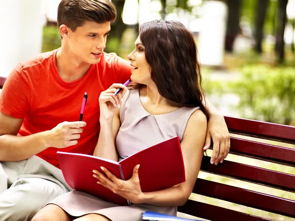 Couple student with notebook outdoor. — Stock Photo, Image