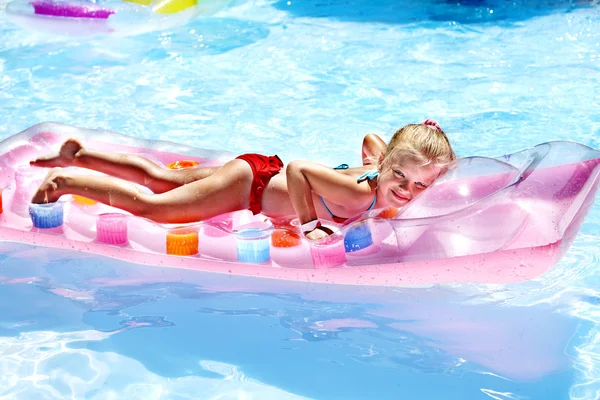 Child swimming on beach mattress. — Stock Photo, Image