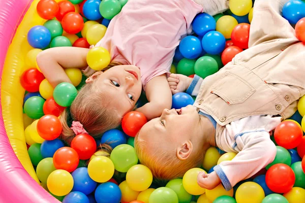 Child in colored ball. — Stock Photo, Image