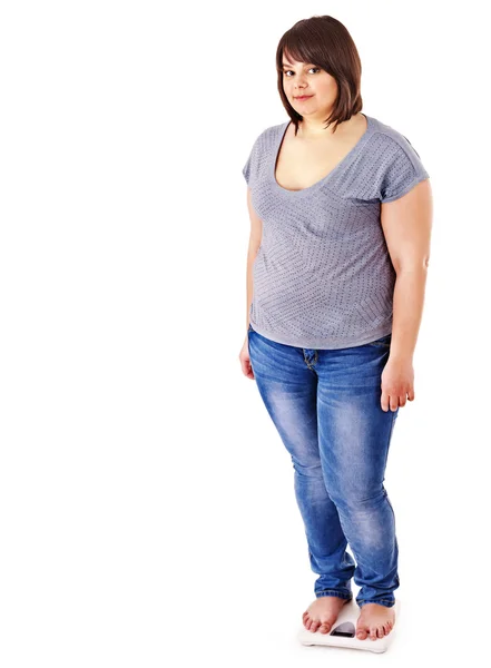 Fat girl on scales. — Stock Photo, Image