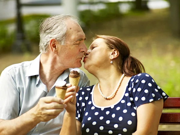 Happy old couple with ice-cream. — Stock Photo, Image
