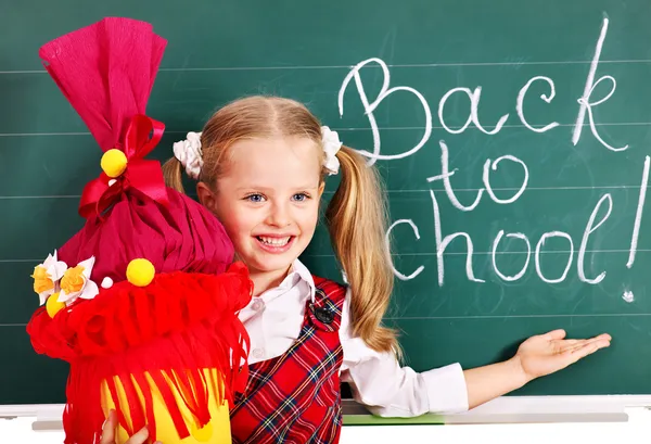 Barn med skolan kon. Stockfoto