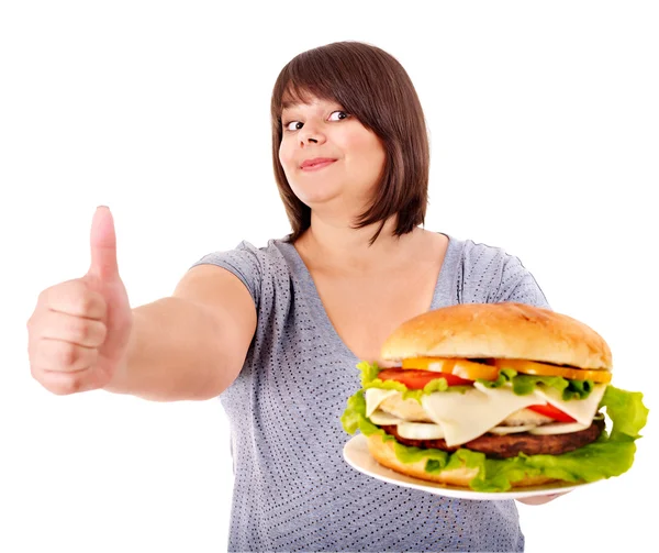 Woman eating hamburger. Stock Picture
