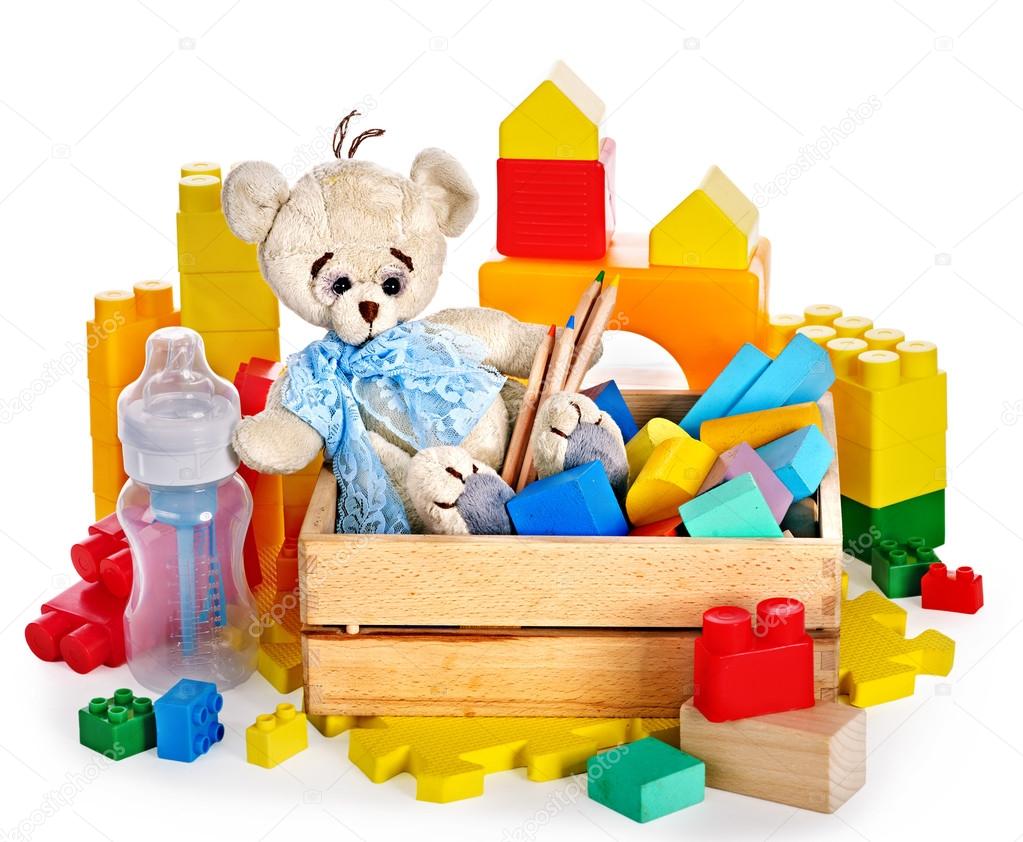 Children toys with teddy bear and cubes.